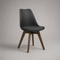 Sedia da pranzo nera con cuscino imbottito, scocca in plastica e gambe in legno color noce, 48 x 55 x 84 cm